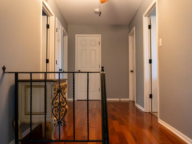 hallway featuring dark wood-type flooring