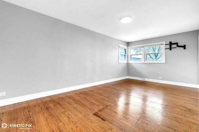 9036 Walnut Ave, Franklin Park, IL 60131 - spare room with baseboards and wood finished floors