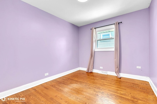 9036 Walnut Ave, Franklin Park, IL 60131 - unfurnished room featuring baseboards and light wood finished floors