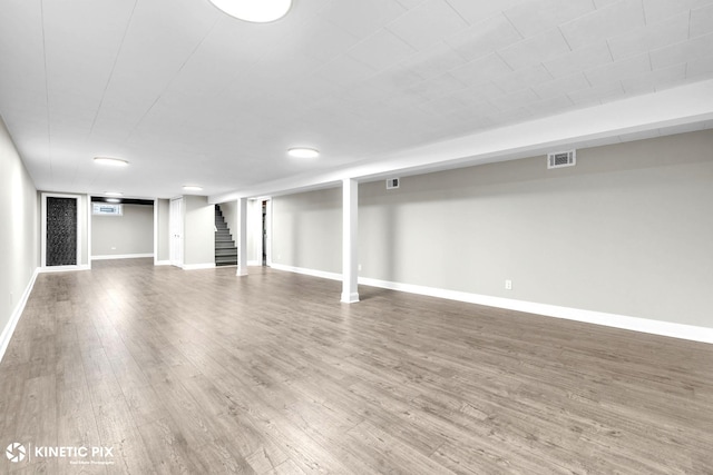 9036 Walnut Ave, Franklin Park, IL 60131 - finished below grade area with stairs, wood finished floors, and baseboards