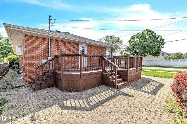 9036 Walnut Ave, Franklin Park, IL 60131 - rear view of property with brick siding, a deck, a patio area, and stairs
