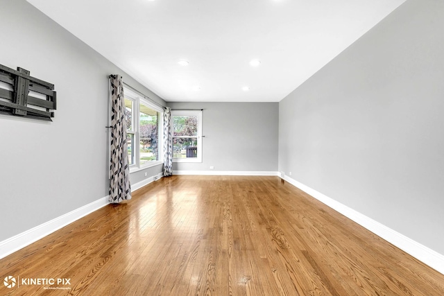 9036 Walnut Ave, Franklin Park, IL 60131 - empty room with light wood-type flooring, baseboards, and recessed lighting