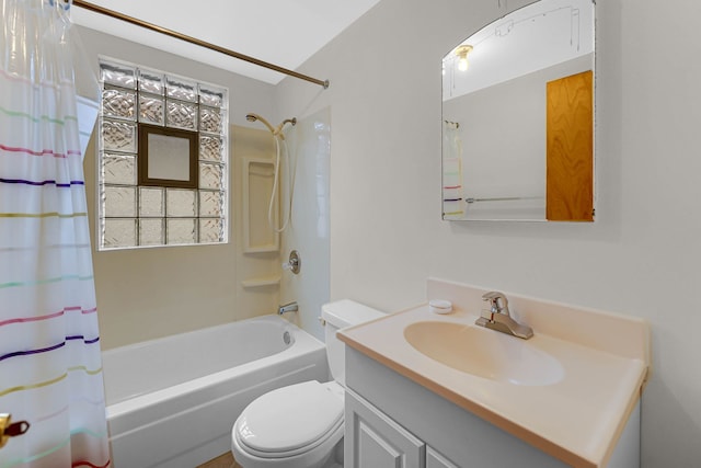 bathroom with shower / tub combo, vanity, and toilet