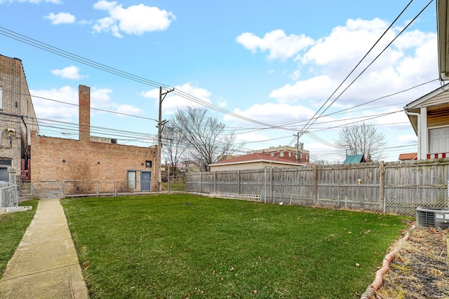 view of yard with a fenced backyard and cooling unit