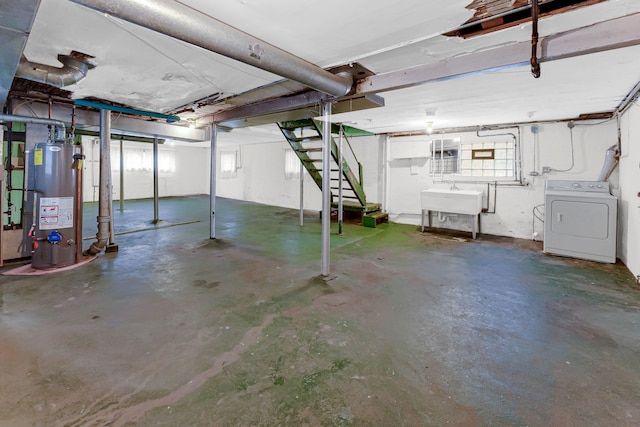 basement featuring washer / clothes dryer, a sink, and gas water heater