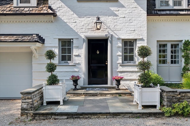 entrance to property featuring a garage