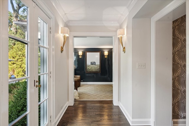 corridor with crown molding, a healthy amount of sunlight, and dark hardwood / wood-style floors