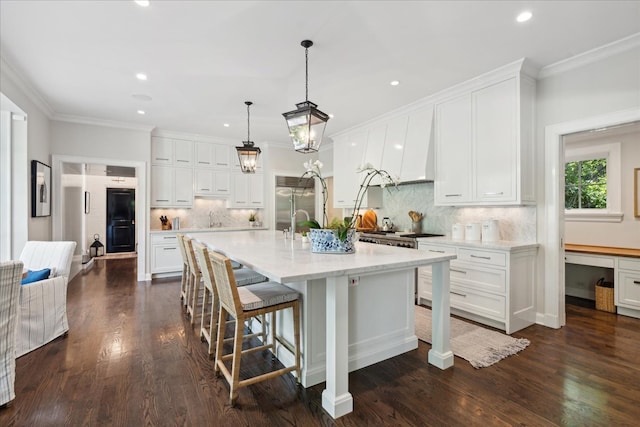 kitchen featuring dark wood-type flooring and white cabinetry