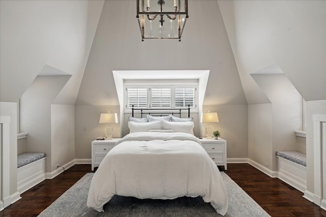 bedroom featuring vaulted ceiling and dark hardwood / wood-style flooring