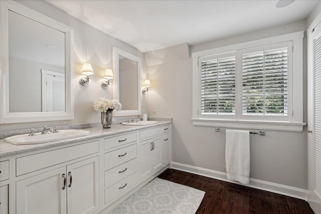 bathroom with vanity and wood-type flooring