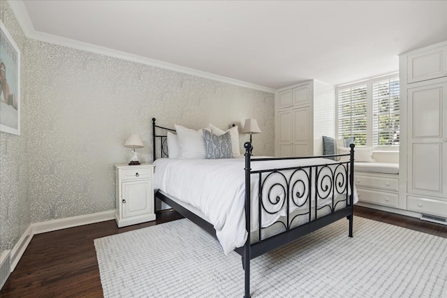 bedroom featuring ornamental molding and dark hardwood / wood-style flooring