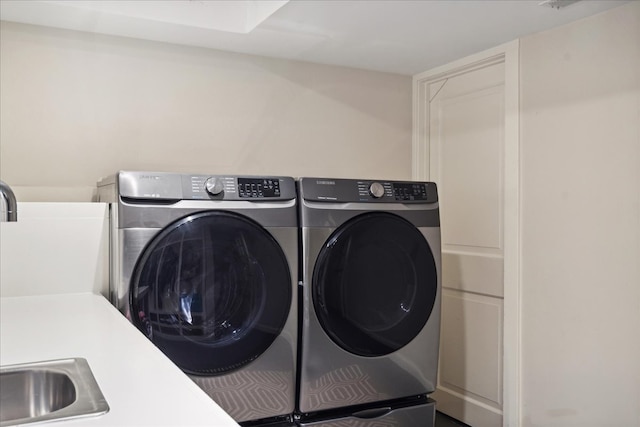 laundry room featuring washer and clothes dryer