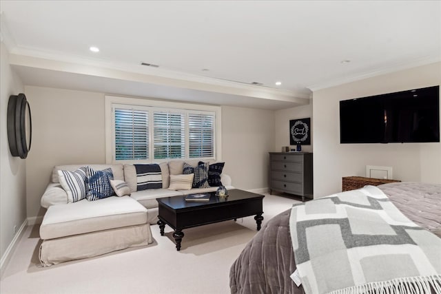 bedroom with ornamental molding and light colored carpet