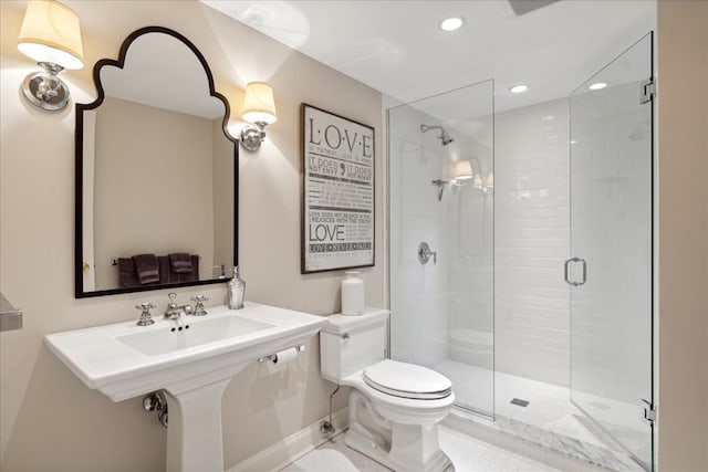 bathroom with toilet, a shower with shower door, tile patterned floors, and sink