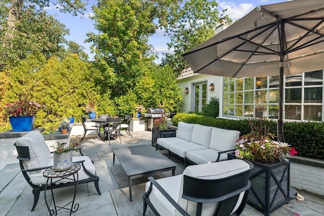 view of patio / terrace with grilling area and an outdoor hangout area