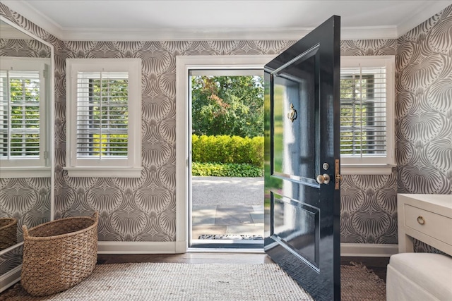 doorway to outside featuring ornamental molding and wood-type flooring