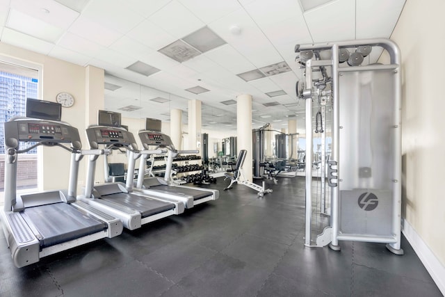 workout area featuring a drop ceiling