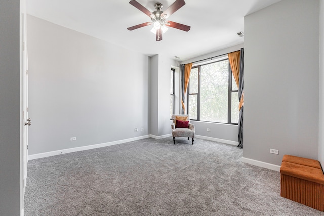 unfurnished room with light carpet and ceiling fan