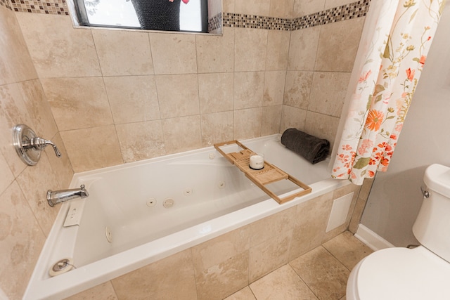 bathroom with shower / tub combo with curtain, toilet, and tile patterned floors