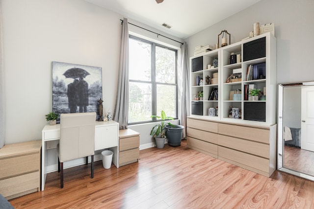 office space with light wood-type flooring