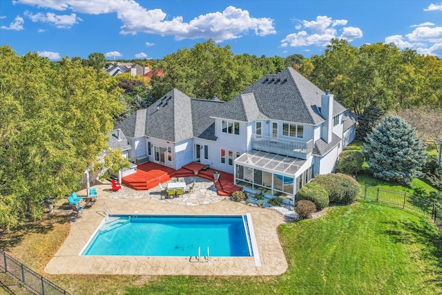 view of pool featuring a deck, a lawn, and a hot tub