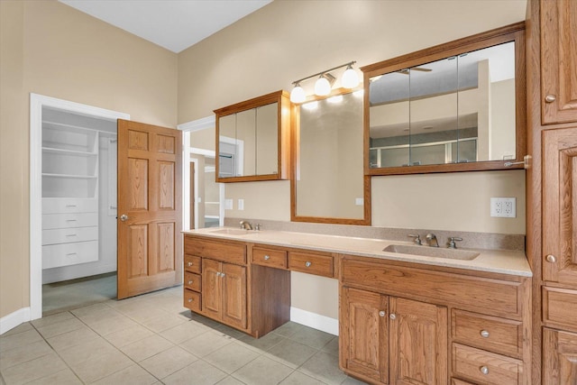 1709 Brighton Ct, Champaign, IL 61822 - bathroom with tile patterned flooring, double vanity, and baseboards