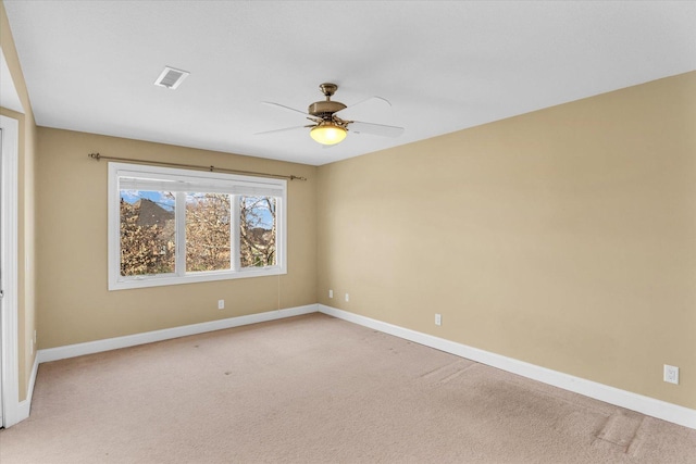 1709 Brighton Ct, Champaign, IL 61822 - unfurnished room with baseboards, a ceiling fan, and light colored carpet
