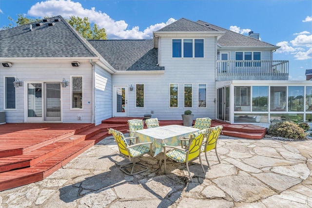 1709 Brighton Ct, Champaign, IL 61822 - back of house with a patio, a balcony, a shingled roof, and outdoor dining space
