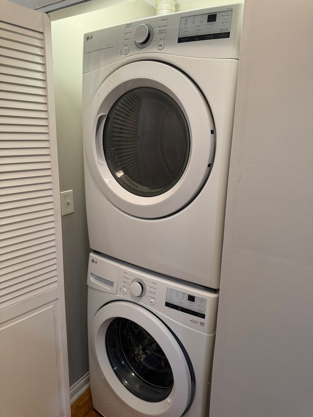 clothes washing area with stacked washer / drying machine