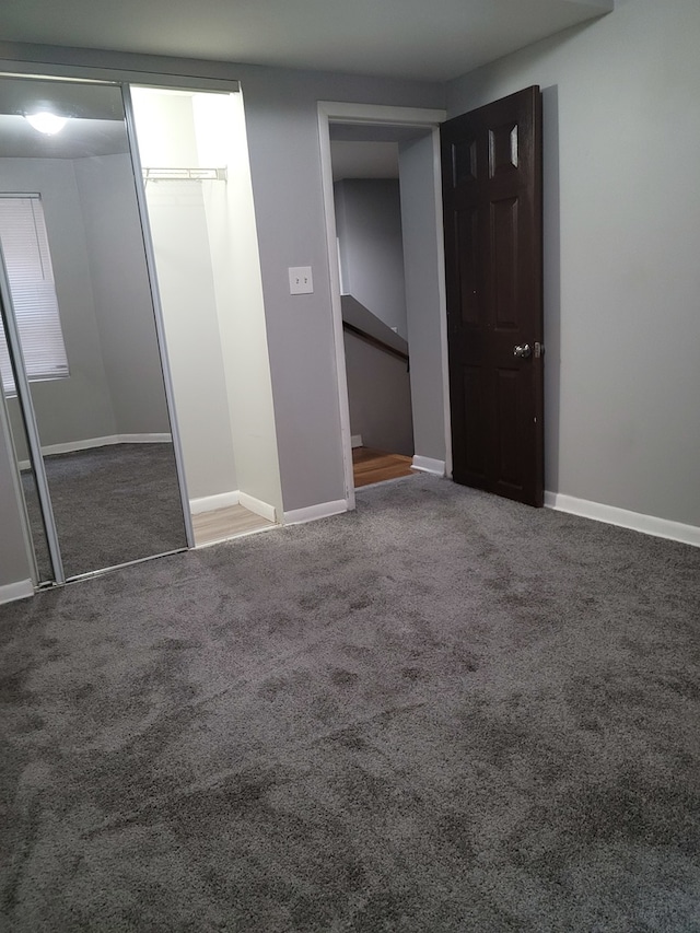 unfurnished bedroom with carpet floors and a closet