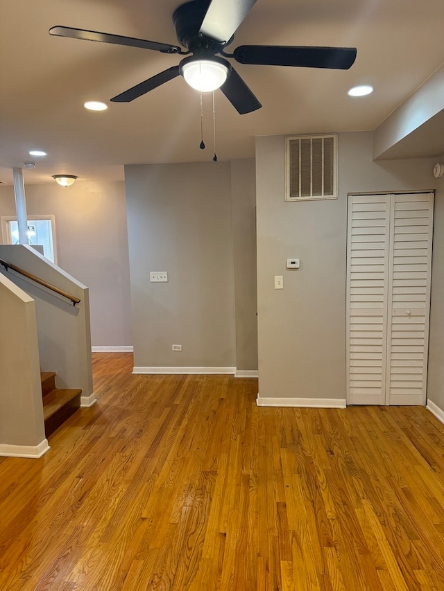 unfurnished room featuring ceiling fan and light wood-type flooring