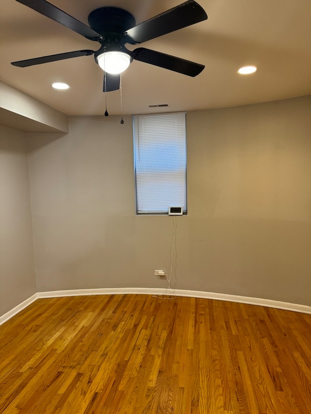 unfurnished room featuring hardwood / wood-style flooring