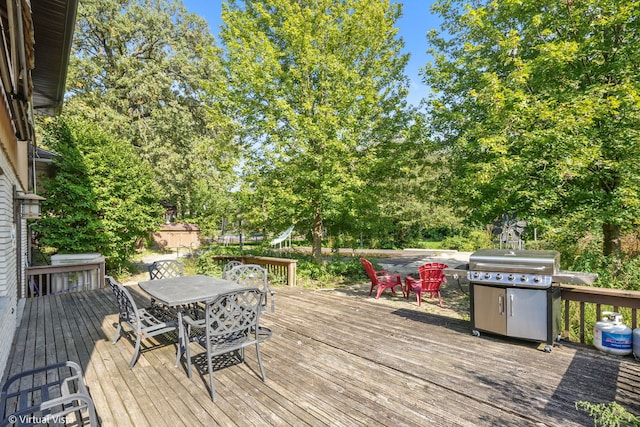 wooden deck with a grill