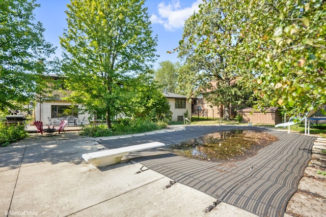 view of pool featuring a patio