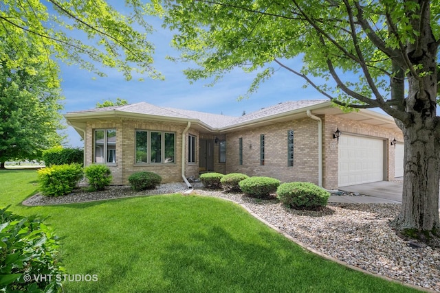 ranch-style house featuring brick siding, a front yard, driveway, and a garage
