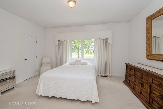 bedroom with light colored carpet