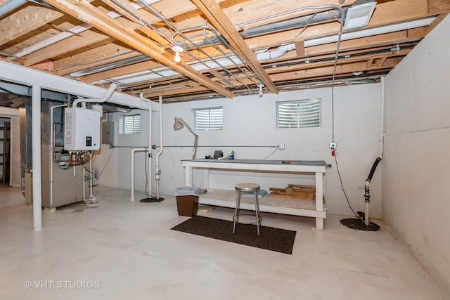 below grade area featuring water heater, visible vents, and electric panel