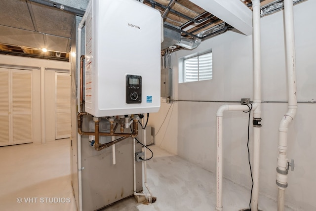 basement featuring tankless water heater