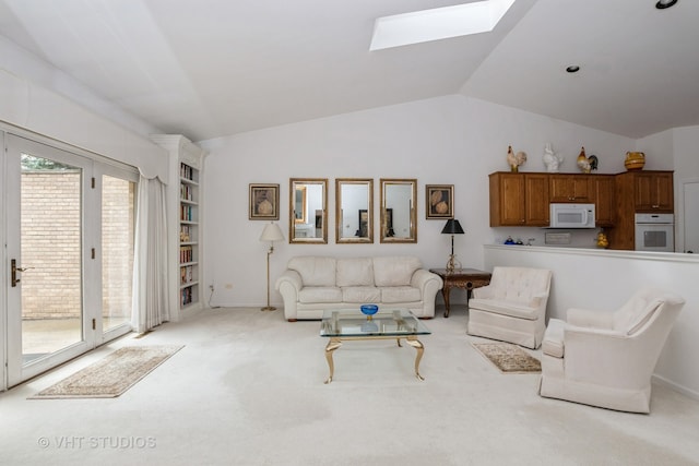 living room with lofted ceiling with skylight and light carpet