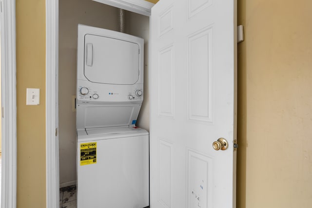 laundry room featuring stacked washer and dryer