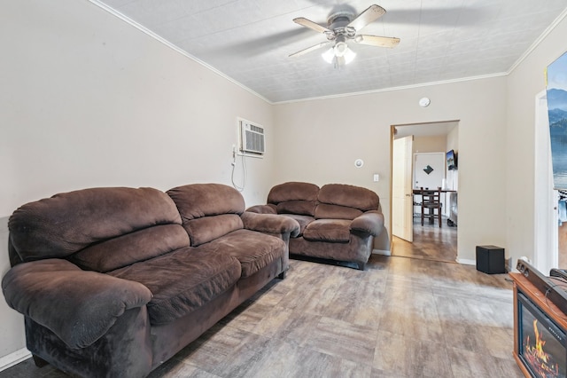 living room with ceiling fan, a wall mounted air conditioner, hardwood / wood-style floors, and ornamental molding