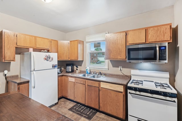 kitchen with white appliances and sink