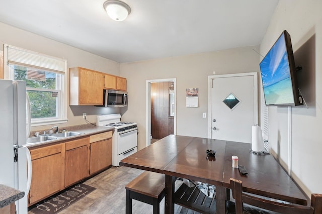 kitchen with sink and white appliances