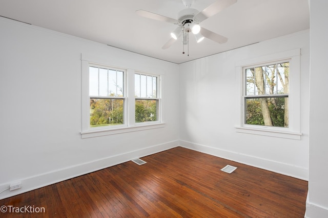 unfurnished room featuring hardwood / wood-style flooring, ceiling fan, and crown molding