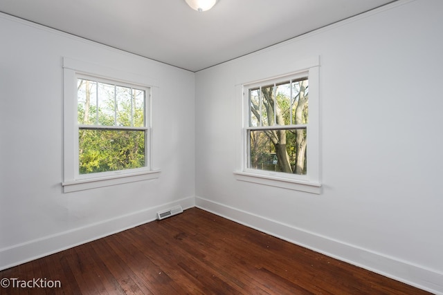 unfurnished room with hardwood / wood-style floors