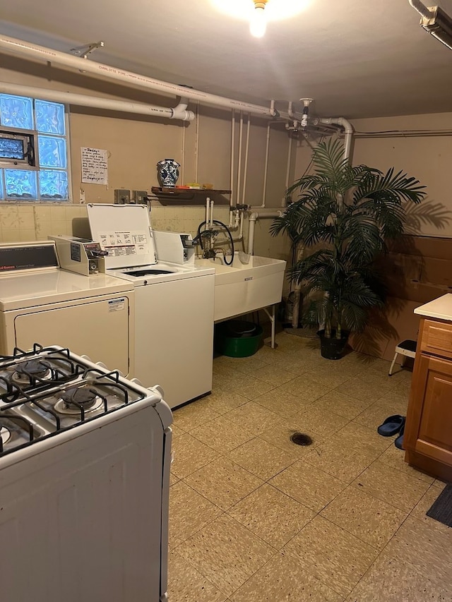 clothes washing area featuring sink