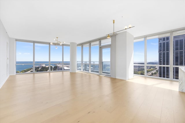 interior space featuring a chandelier and a water view