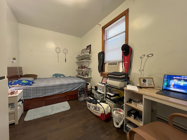 bedroom featuring cooling unit and dark wood-type flooring