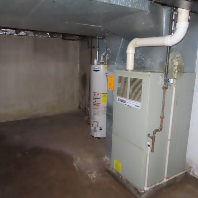 utility room featuring water heater