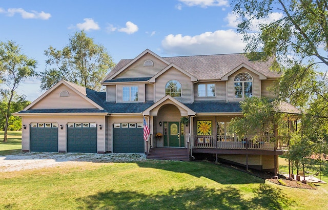 view of front of home featuring a garage and a front lawn